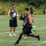 man running with football in hand